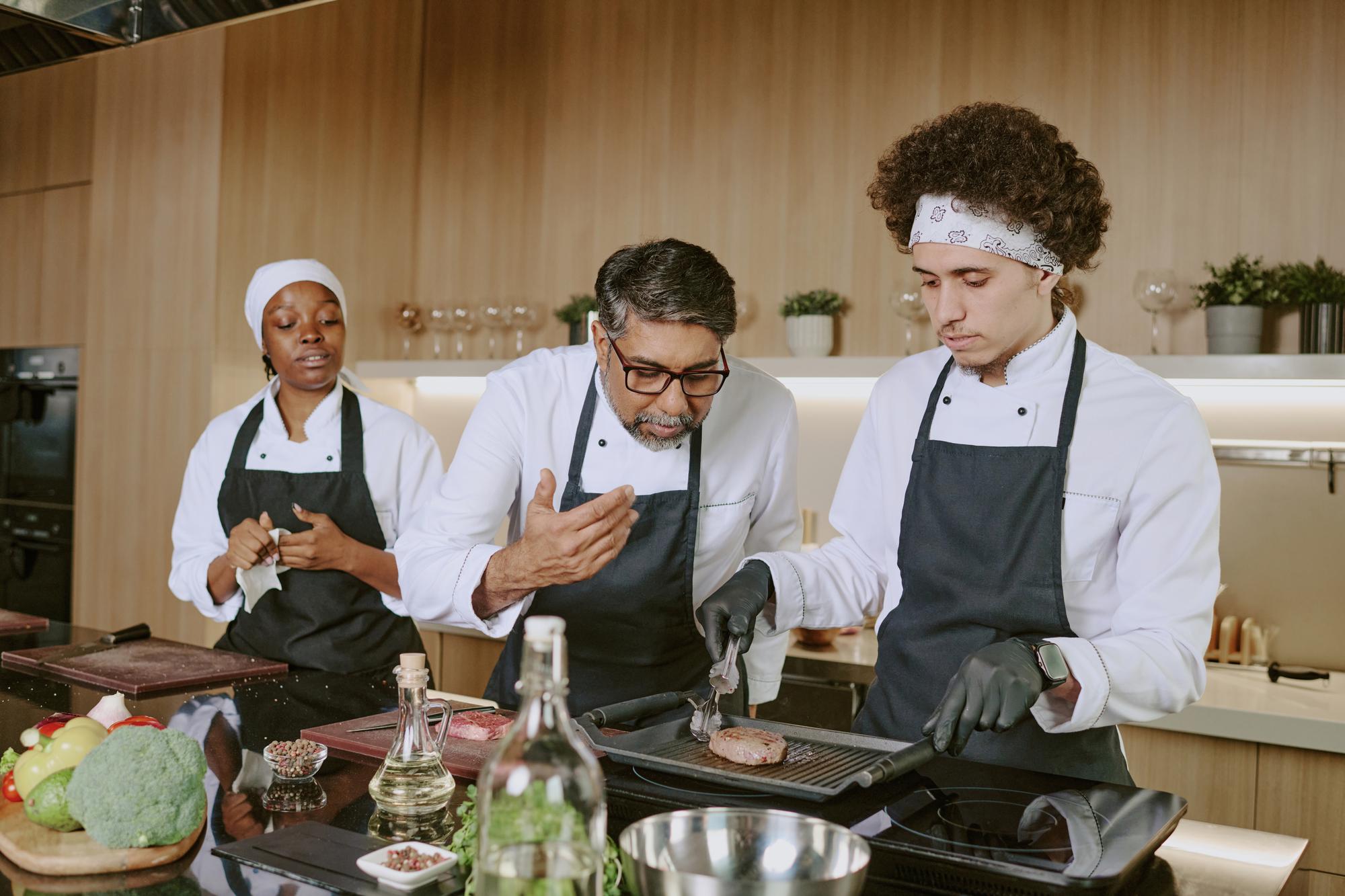 chef instructing team during workshop